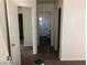 Hallway view of an open doorway leading to the full bathroom with shower and vanity at 11882 Snow Bank St, Las Vegas, NV 89183