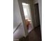 Hallway view from stairs to the full bathroom with shower and vanity at 11882 Snow Bank St, Las Vegas, NV 89183