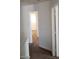 Hallway with neutral paint, carpet and doors leading to other rooms at 11882 Snow Bank St, Las Vegas, NV 89183