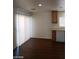 The kitchen features wood cabinets and the eat-in area has sliding glass door at 11882 Snow Bank St, Las Vegas, NV 89183