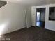 Open-concept living room with neutral paint, carpet floors, and views of the kitchen and back yard at 11882 Snow Bank St, Las Vegas, NV 89183