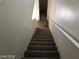 Carpeted stairs leading down to the first floor at 11882 Snow Bank St, Las Vegas, NV 89183