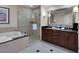 Luxurious bathroom features a glass shower, soaking tub, and double sink vanity at 145 E Harmon Ave # 409, Las Vegas, NV 89109