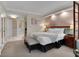 Spacious bedroom with a king-size bed, ensuite bathroom, and comfortable seating at 145 E Harmon Ave # 409, Las Vegas, NV 89109