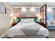 Inviting bedroom features a king-size bed, bedside lamps, and access to living room at 145 E Harmon Ave # 409, Las Vegas, NV 89109
