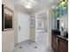 The entryway with tiled floors leads to a pristine bathroom and a serene bathtub at 145 E Harmon Ave # 409, Las Vegas, NV 89109