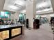 Gym area with modern exercise equipment, illuminated front desk, and large windows at 145 E Harmon Ave # 409, Las Vegas, NV 89109