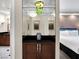 Elegant hallway with a mirrored wall and views into the bedroom and bathroom at 145 E Harmon Ave # 409, Las Vegas, NV 89109