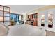 Stylish living area featuring a partial kitchen, comfortable seating, and views of cityscape at 145 E Harmon Ave # 409, Las Vegas, NV 89109
