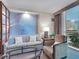 A cozy living room features a large window, stylish seating, and neutral decor at 145 E Harmon Ave # 409, Las Vegas, NV 89109