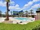 Outdoor pool area with palm trees, lounge chairs, cabanas, and view of the MGM Grand at 145 E Harmon Ave # 409, Las Vegas, NV 89109