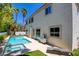 Backyard with a pool, spa, palm trees and artificial turf at 153 Cascade Lake St, Las Vegas, NV 89148