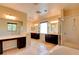 Expansive primary bathroom with dual vanities, a soaking tub, and a shower at 153 Cascade Lake St, Las Vegas, NV 89148