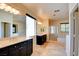 Large primary bathroom with dual sinks, vanities, shower, and tub at 153 Cascade Lake St, Las Vegas, NV 89148