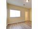 Bedroom with natural light, neutral walls, and wood floors at 153 Cascade Lake St, Las Vegas, NV 89148