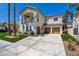 Beautiful two-story stucco home with three-car garage, desert landscaping, and balcony at 153 Cascade Lake St, Las Vegas, NV 89148