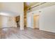 Large living room with balcony, staircase, laminate flooring, and neutral color palette at 153 Cascade Lake St, Las Vegas, NV 89148