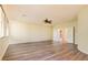 Spacious living room showcasing wood floors, large windows, and neutral walls at 153 Cascade Lake St, Las Vegas, NV 89148