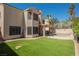 Expansive backyard featuring artificial turf, a covered patio, and sparkling pool perfect for outdoor enjoyment at 2008 Spruce Brook Dr, Henderson, NV 89074