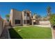 Large backyard with artificial turf, covered patio, and sparkling pool offers a luxurious outdoor retreat at 2008 Spruce Brook Dr, Henderson, NV 89074