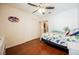bedroom with hardwood floors, closet, ceiling fan, and colorful dinosaur bedding at 2008 Spruce Brook Dr, Henderson, NV 89074
