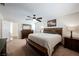 Well-lit main bedroom with a ceiling fan, two windows, and comfortable furnishings at 2008 Spruce Brook Dr, Henderson, NV 89074