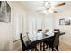 Cozy dining room with shuttered windows and a ceiling fan with lights at 2008 Spruce Brook Dr, Henderson, NV 89074