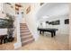 Bright entryway showcasing a staircase and stylish decor that leads to an open layout at 2008 Spruce Brook Dr, Henderson, NV 89074