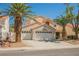 Beautiful two-story home with a three car garage and mature palm trees at 2008 Spruce Brook Dr, Henderson, NV 89074