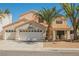 Charming two-story home with a spacious three-car garage and well-manicured landscaping at 2008 Spruce Brook Dr, Henderson, NV 89074