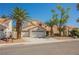 Attractive two-story home with three-car garage and mature palm trees in a well-maintained neighborhood at 2008 Spruce Brook Dr, Henderson, NV 89074