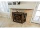Close-up of the fireplace featuring tile surround, white mantle and decorative screen at 2008 Spruce Brook Dr, Henderson, NV 89074
