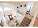 Grand foyer with stairs, beautiful light fixtures, and tiled flooring at 2008 Spruce Brook Dr, Henderson, NV 89074