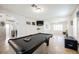 Spacious game room with a pool table, tile floors, and arched doorways at 2008 Spruce Brook Dr, Henderson, NV 89074