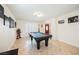 Spacious game room with a pool table and decorative artwork on the walls at 2008 Spruce Brook Dr, Henderson, NV 89074