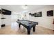 Entertain in this game room with a pool table and decorative wall art at 2008 Spruce Brook Dr, Henderson, NV 89074