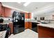 Kitchen with granite countertops, wood cabinets and stainless steel appliances at 2008 Spruce Brook Dr, Henderson, NV 89074