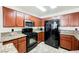 Kitchen features granite countertops, wood cabinets and stainless steel appliances at 2008 Spruce Brook Dr, Henderson, NV 89074