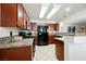 Kitchen features granite countertops, wood cabinets and stainless steel appliances at 2008 Spruce Brook Dr, Henderson, NV 89074