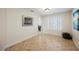 Bright living room featuring tile floors, shuttered windows, and neutral wall color at 2008 Spruce Brook Dr, Henderson, NV 89074