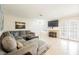 Spacious living room featuring tile floors, a cozy couch, and abundant natural light at 2008 Spruce Brook Dr, Henderson, NV 89074