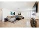 Comfortable living room with tile flooring, a large sectional sofa, and stylish decor at 2008 Spruce Brook Dr, Henderson, NV 89074