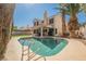Private backyard oasis with a sparkling pool and lush green landscaping, ideal for relaxation at 2008 Spruce Brook Dr, Henderson, NV 89074