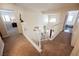 Carpeted staircase with white railings leading to a landing with views of the entry and other rooms at 2008 Spruce Brook Dr, Henderson, NV 89074
