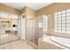 Bright bathroom featuring tub and shower at 215 Great Gable Dr, Las Vegas, NV 89183
