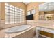Bathroom with large tub and a vanity area at 215 Great Gable Dr, Las Vegas, NV 89183
