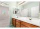 Bathroom featuring double vanity, with a large mirror and tiled floor at 215 Great Gable Dr, Las Vegas, NV 89183