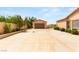 Long driveway leads to a detached garage and a well-maintained home, offering ample parking and curb appeal at 215 Great Gable Dr, Las Vegas, NV 89183