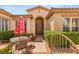 Inviting front entrance with a charming outdoor seating area and a beautifully landscaped walkway at 215 Great Gable Dr, Las Vegas, NV 89183