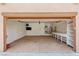 Spacious garage with workbench, storage shelves, utility sink, and TV, providing ample space for hobbies and parking at 215 Great Gable Dr, Las Vegas, NV 89183